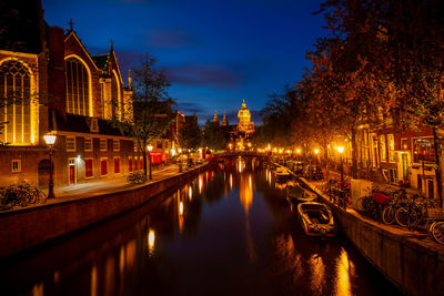 Reflection of illuminated buildings in canal at night