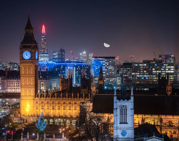 Illuminated buildings in city at night