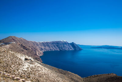 Scenic view of sea against clear blue sky