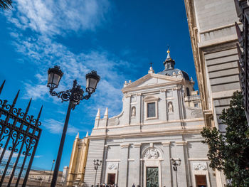 Low angle view of buildings against blue sky