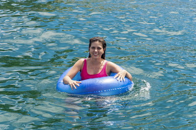 Woman swimming in sea