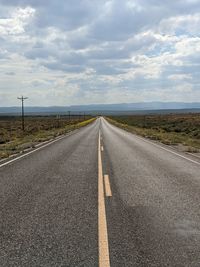 Empty road against sky