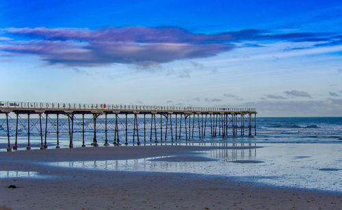 Scenic view of beach against sky during sunset