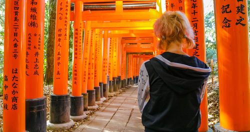 Rear view of woman at temple