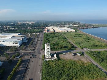 High angle view of road by city against sky