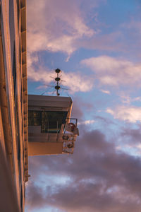 Low angle view of building against sky at sunset