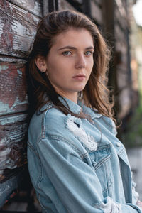 Portrait of beautiful young woman standing outdoors