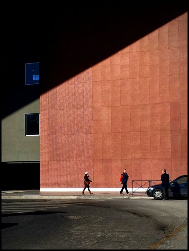 architecture, built structure, building exterior, walking, men, street, city, city life, sidewalk, lifestyles, person, full length, shadow, sunlight, building, road, silhouette, road marking