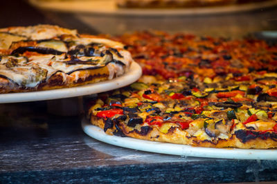 Close-up of pizzas on table