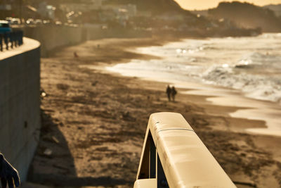 High angle view of railing by sea