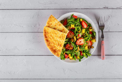 Directly above shot of salad in plate on table