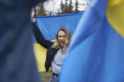 Portrait of woman holding umbrella