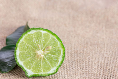 Close-up of lemon slice on table