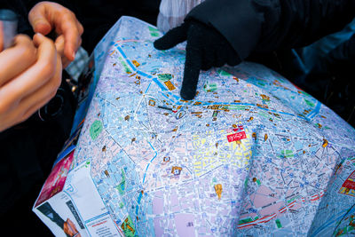 High angle view of people holding paper