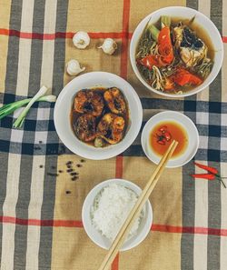 Rice with fish, high angle view of meal served on table