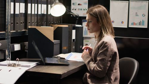 Young businesswoman working in cafe