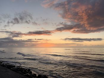 Scenic view of sea against sky during sunset