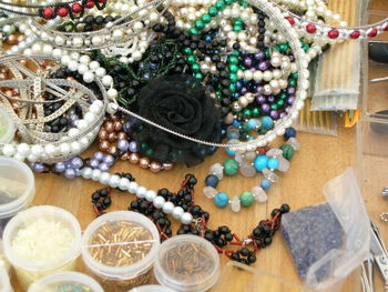 High angle view of various fashion jewelries on table