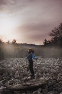 Full length of man standing on rock