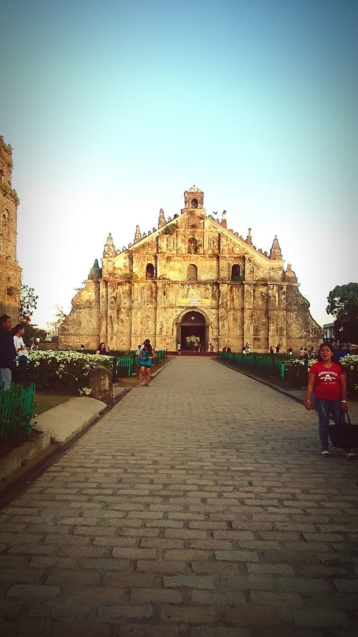 architecture, built structure, building exterior, clear sky, history, religion, the way forward, place of worship, famous place, travel, travel destinations, spirituality, tourism, incidental people, cobblestone, copy space, sky, temple - building, street