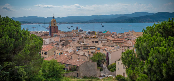 High angle view of buildings by sea