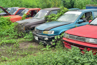 Abandoned car on field