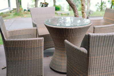 Close-up of chairs and table at cafe