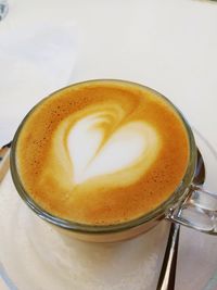 Close-up of cappuccino on table