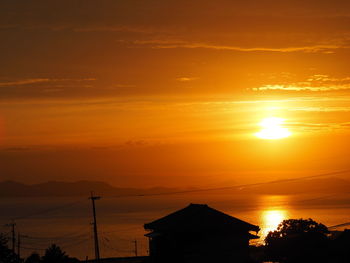 Scenic view of sea against romantic sky at sunset