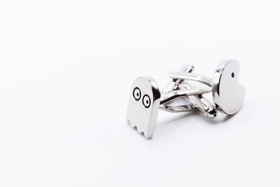 Close-up of wedding rings on white background