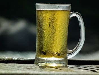 Close-up of beer glass on table