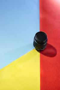 High angle view of multi colored paper on table against wall