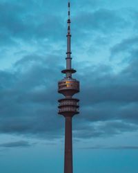 Low angle view of communications tower against sky