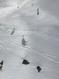 High angle view of people skiing on snow