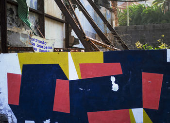 Close-up of clothes hanging on built structure