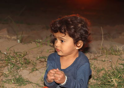 Portrait of cute boy looking away