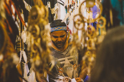 Man selling stuff in the market in goa, india