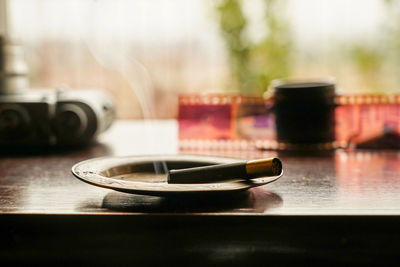 Close-up of coffee cup on table