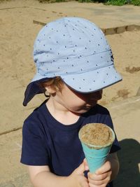 Midsection of woman holding ice cream cone