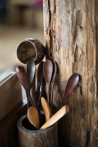 Close-up of wooden spoons in container