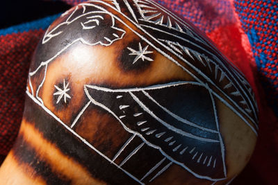 Close-up of carving on pot