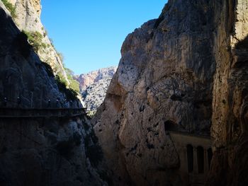 Low angle view of rock formations against sky