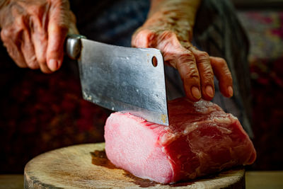 Close-up of person preparing food on table