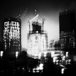 Illuminated buildings in city at night