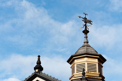 Low angle view of spire against sky