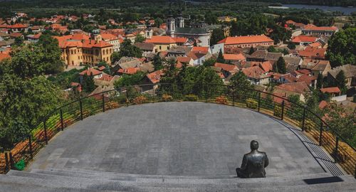 Statue against townscape