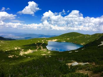 Scenic view of lake against mountain range