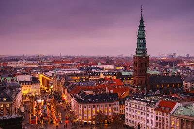 High angle view of illuminated buildings in city