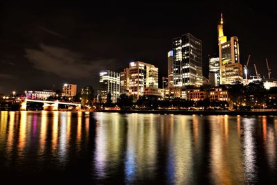 Illuminated city at waterfront