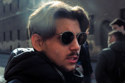 Portrait of young man wearing sunglasses